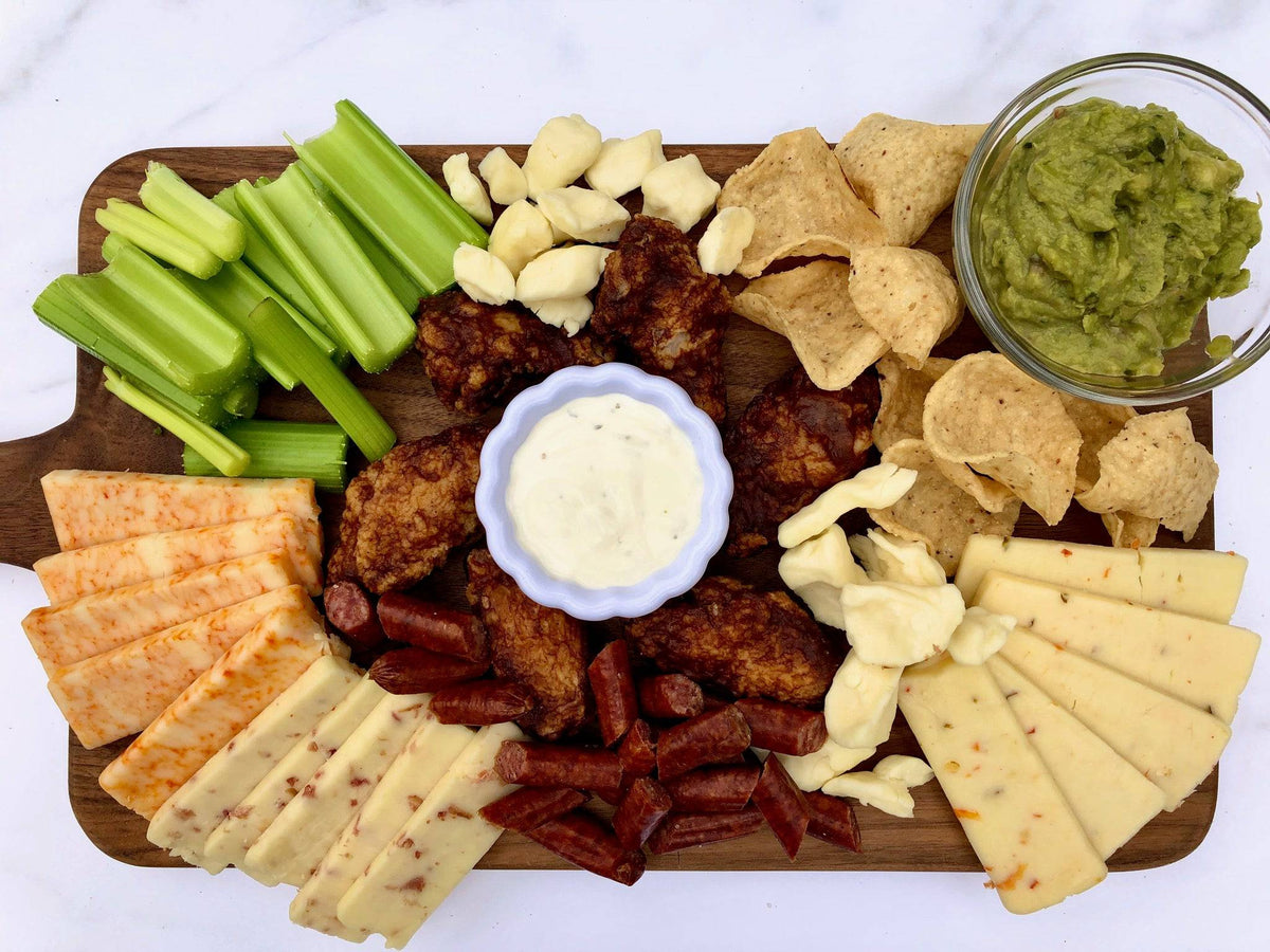 A Gardner's cheese and sausage board with curds, aged cheddar and snack sticks